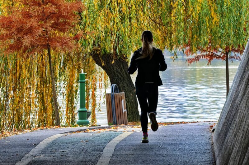 Woman running by the water
