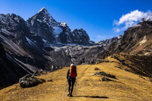 Solo female hiker walking up Mount. Everest.