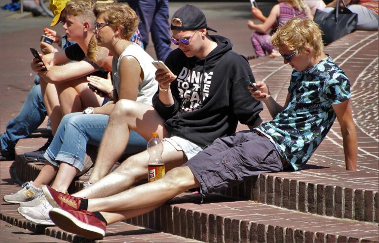 Teens using their smartphone for messaging apps